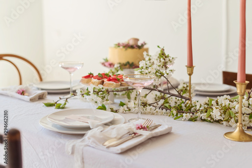 Festive wedding table with cake, champagne and snacks © iwavephoto