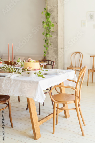 Bridal wedding table with cake  candle  champagne and snacks