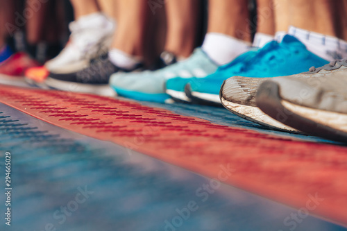 Marathon runners shoes in front of the start line Close up