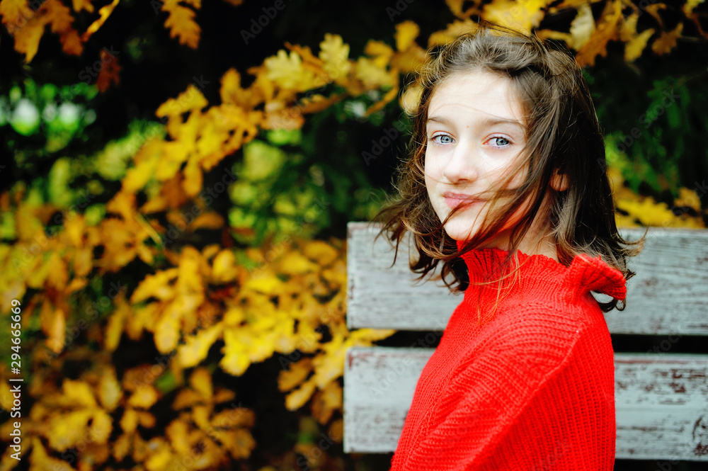 Teenage girl sitting up the oak tree. Teenage girl sitting up the oak tree.