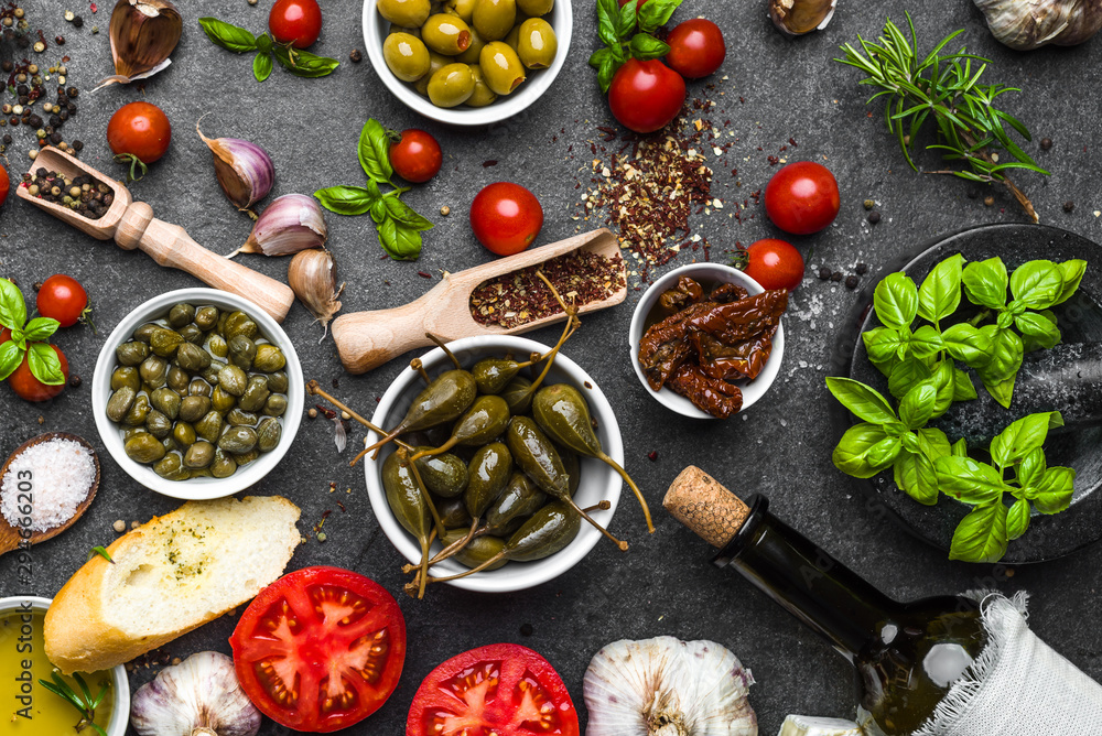 Mediterranean diet background. Cooking ingredients on dark slate. Mediterranean diet background. Cooking ingredients on dark slate.