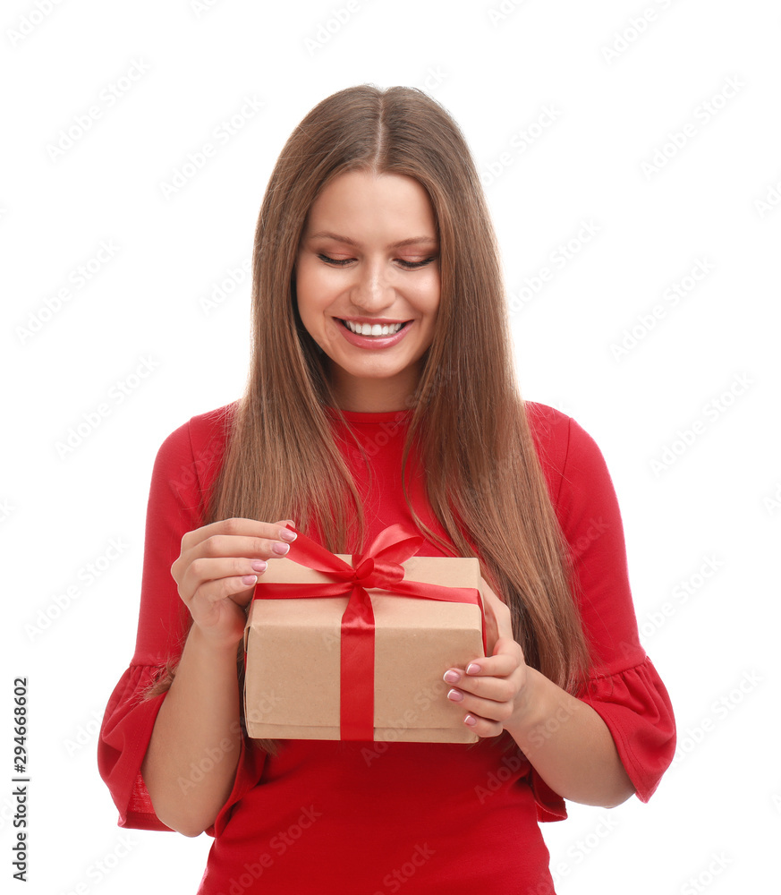 Happy young woman with Christmas gift on white background Happy young woman with Christmas gift on white background