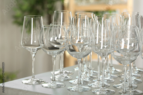 Set of empty glasses on grey table