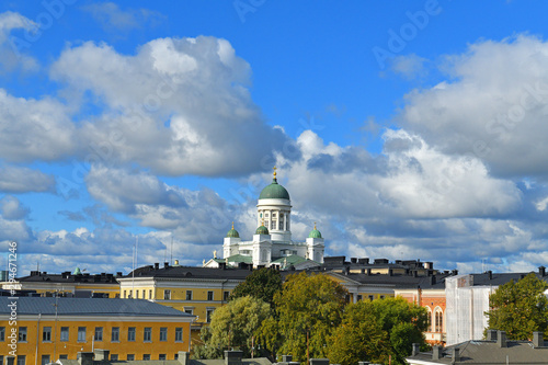 Cityscape with Lutheran Cathedral (Tuomiokirkko) on background of blue sky and clouds. Helsinki, Finland