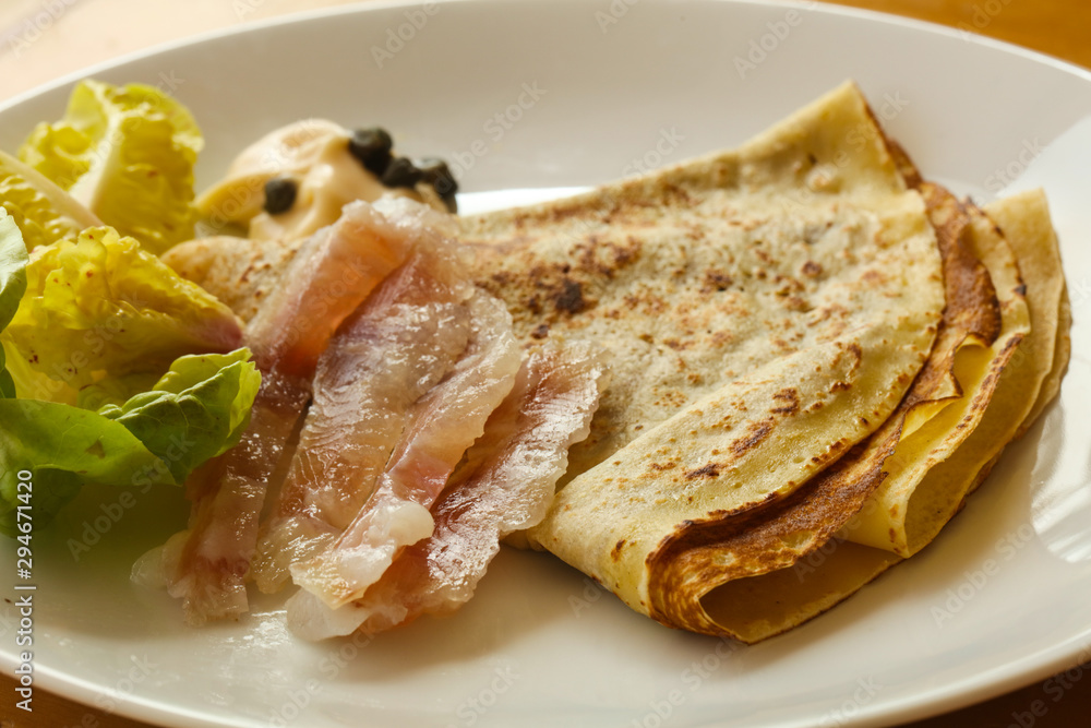 Gravlax with pancake served salad Gravlax with pancake served salad