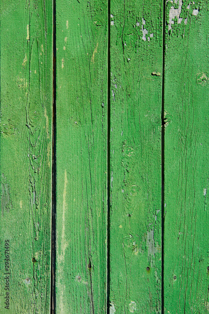 Wooden surface with cracked green paint texture Wooden surface with cracked green paint texture