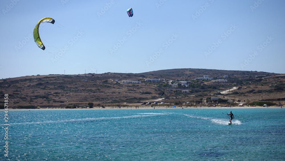 Kite surfing in iconic turquoise sandy beach of Pori, Koufonisi island, Small Cyclades, Greece