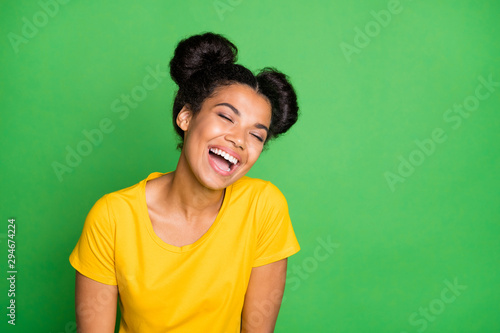Photo of amazing dark skin lady listening great humorous story laughing out loud wear casual yellow t-shirt and red pants isolated green background