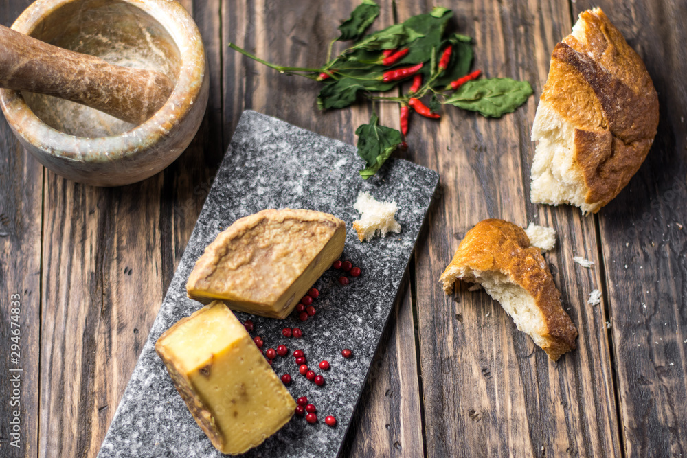 Artesian Cheese and a homemade souer dough bread on wooden background. Artesian Cheese and a homemade souer dough bread on wooden background.