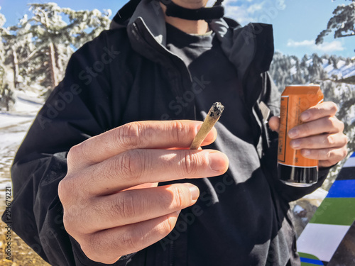 Man with Joint, Beer, and Snowboard