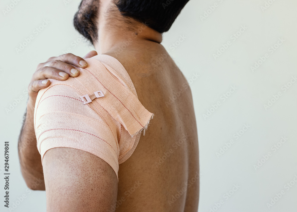 man shoulder with crepe bandage for recovery of muscle recovery Stock Photo  | Adobe Stock