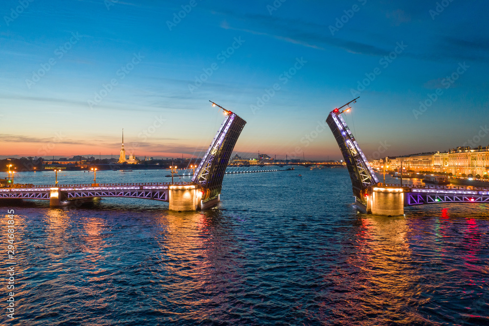 White nights in Saint-Petersburg - the opening of the Palace drawbridge, a view of the Peter and Paul Cathedral