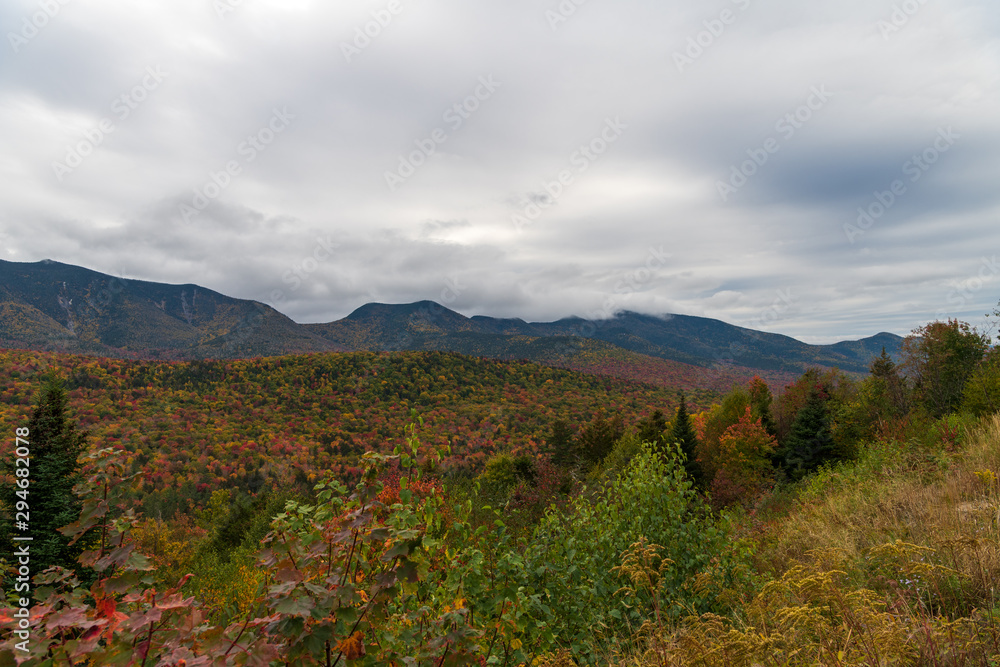 Mountain views during foliage season with clouds Mountain views during foliage season with clouds