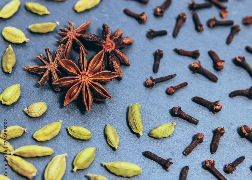 Seasonal ingredients to make a chai tea up-close (whole cloves, star anise, green cardamon, & cinnamon bark) Seasonal ingredients to make a chai tea up-close (whole cloves, star anise, green cardamon, & cinnamon bark)