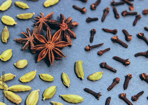 Seasonal ingredients to make a chai tea up-close (whole cloves, star anise, green cardamon, & cinnamon bark)