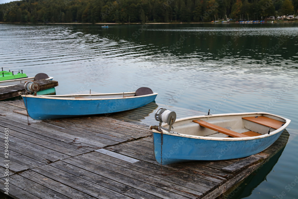 Fishing boats on the shore of the lake Fishing boats on the shore of the lake