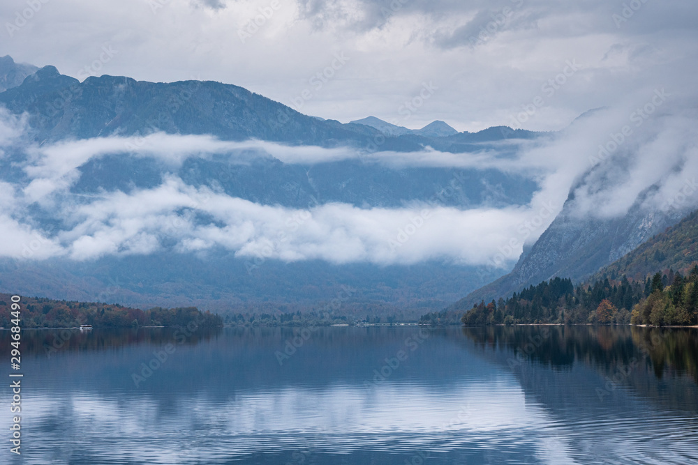 Beautiful view of misty mountain Bohinj lake in the morning