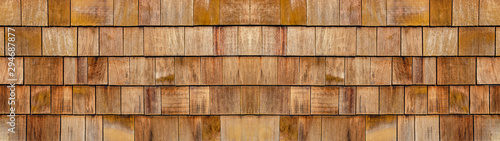 Old brown rustic light bright wooden shingle wall  texture - wood background panorama banner long pattern photo