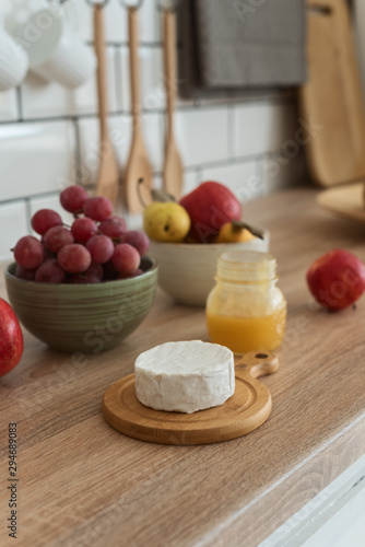 Cheese, honey and fruit on the kitchen table,healthy breakfast
