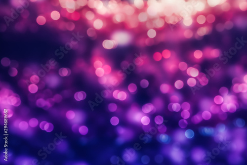 Abstract holiday background with multicolored defocused lights