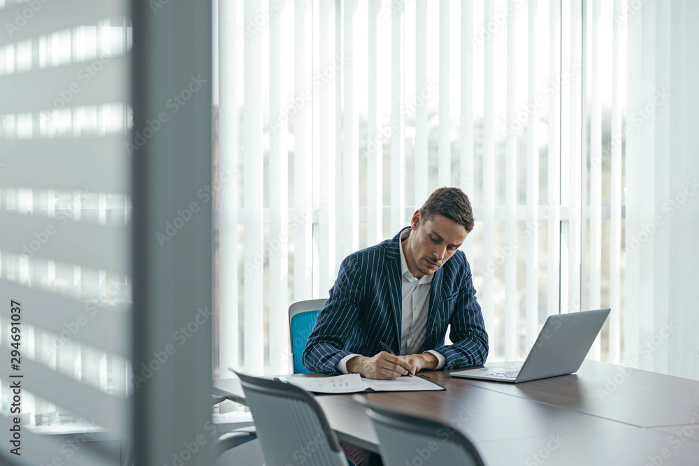 Businessman Writing at Work Businessman Writing at Work