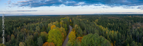 Beautiful autumn landscape. Panorama view of forest and road from above. Latvian nature.