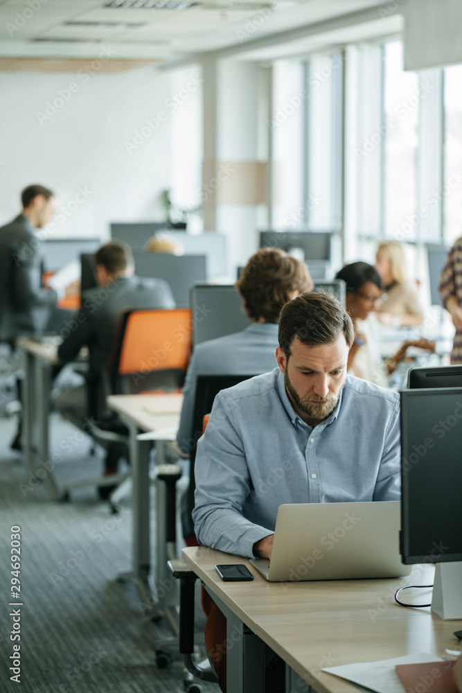 Businessman Working at Open Space Office Businessman Working at Open Space Office