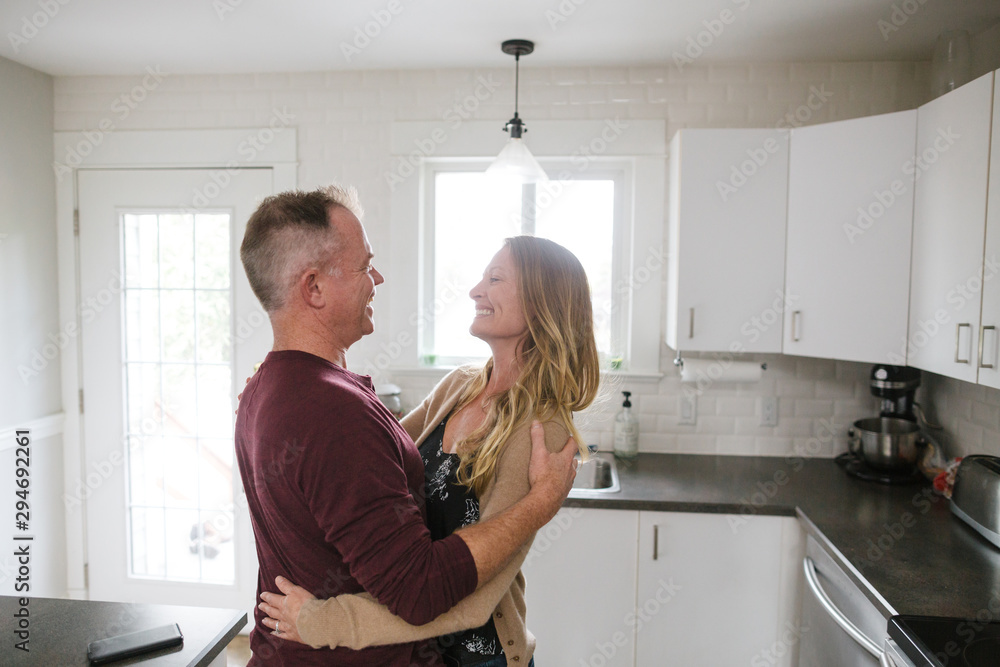 Happy middle age couple enjoying each other at home. Happy middle age couple enjoying each other at home.