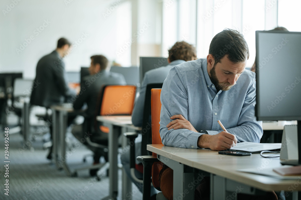 Businessman Working at Open Space Office Businessman Working at Open Space Office