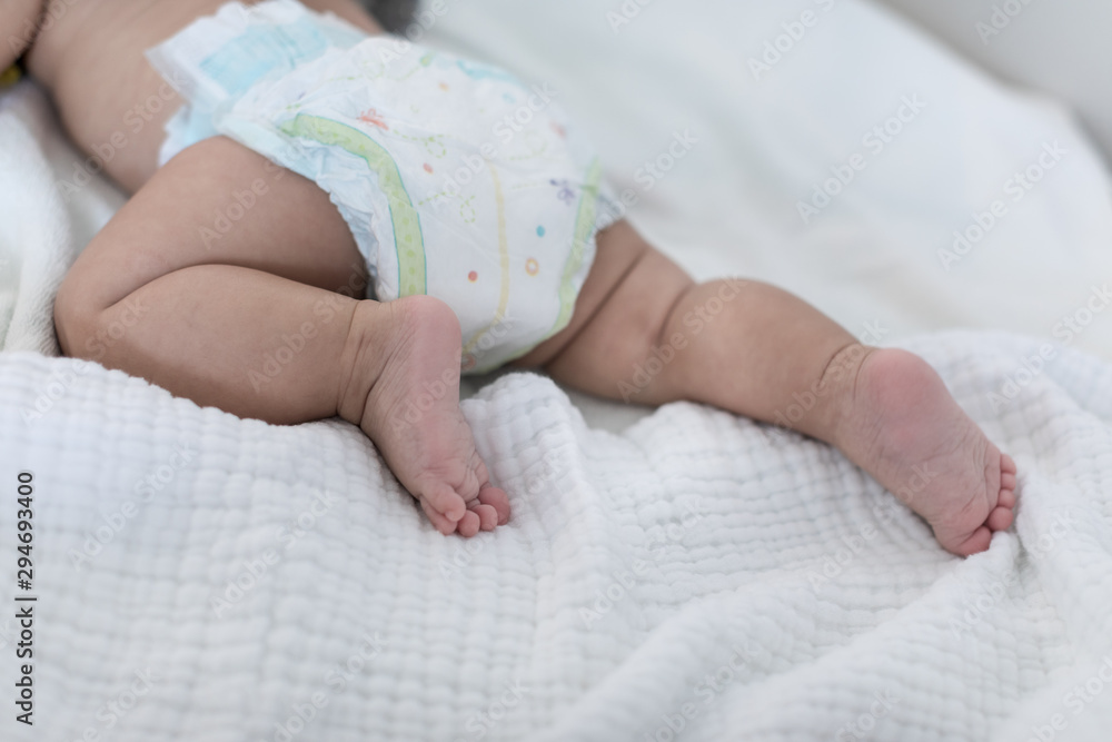 Baby legs with cloth diaper on blanket Baby legs with cloth diaper on blanket