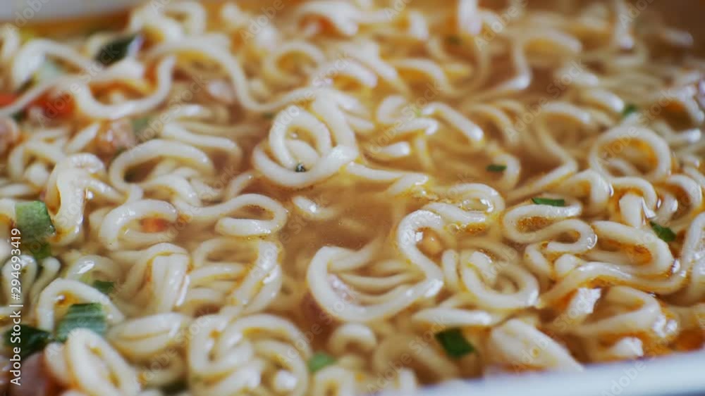 fast food.unhealthy diet.dry instant noodles in a broth with spices.close-up fast food.unhealthy diet.dry instant noodles in a broth with spices.close-up