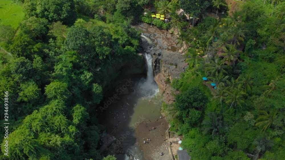 Aerial shot of the Tegenungan Waterfall on the Bali island, Ubud Aerial shot of the Tegenungan Waterfall on the Bali island, Ubud