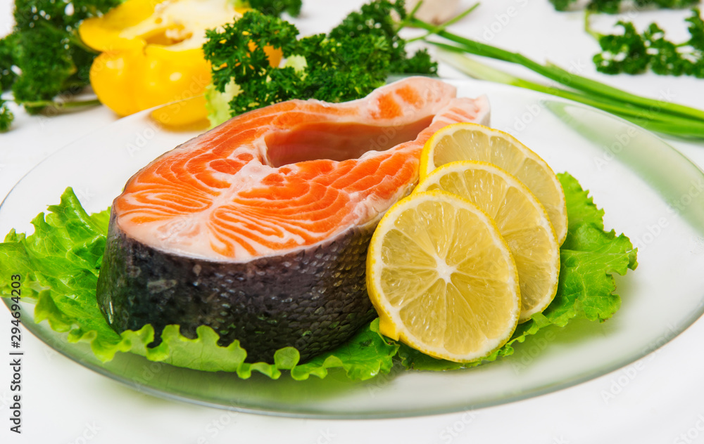 Salmon fish with lemon on lettuce Salmon fish with lemon on lettuce