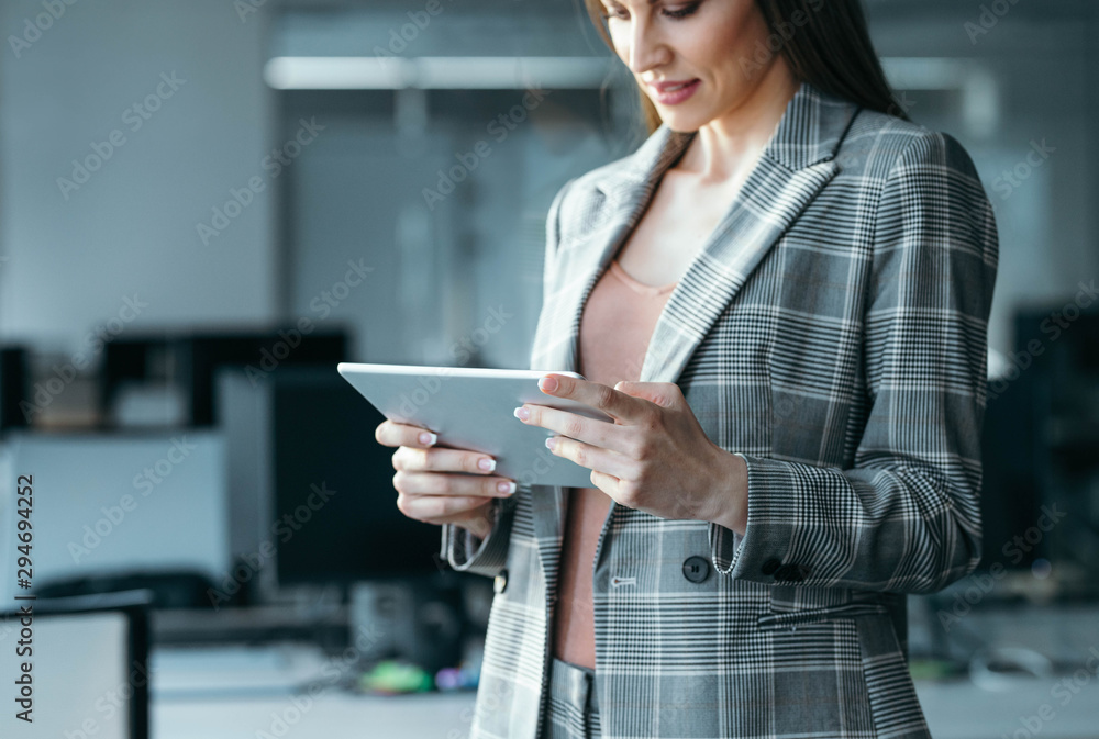 Young Businesswoman Reading on her Tablet Young Businesswoman Reading on her Tablet