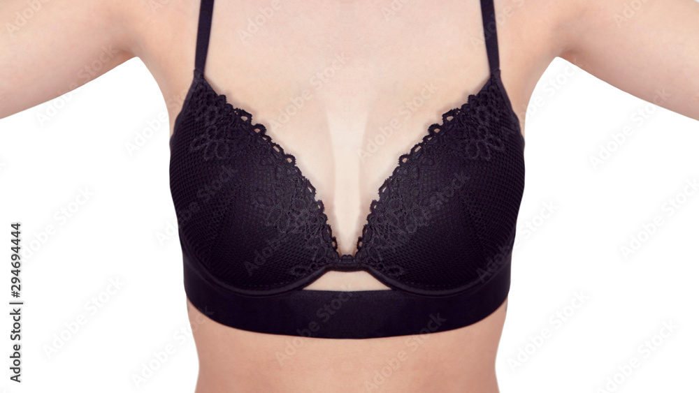 Front view close-up of slim woman wearing black sports bra with floral pattern Front view close-up of slim woman wearing black sports bra with floral pattern