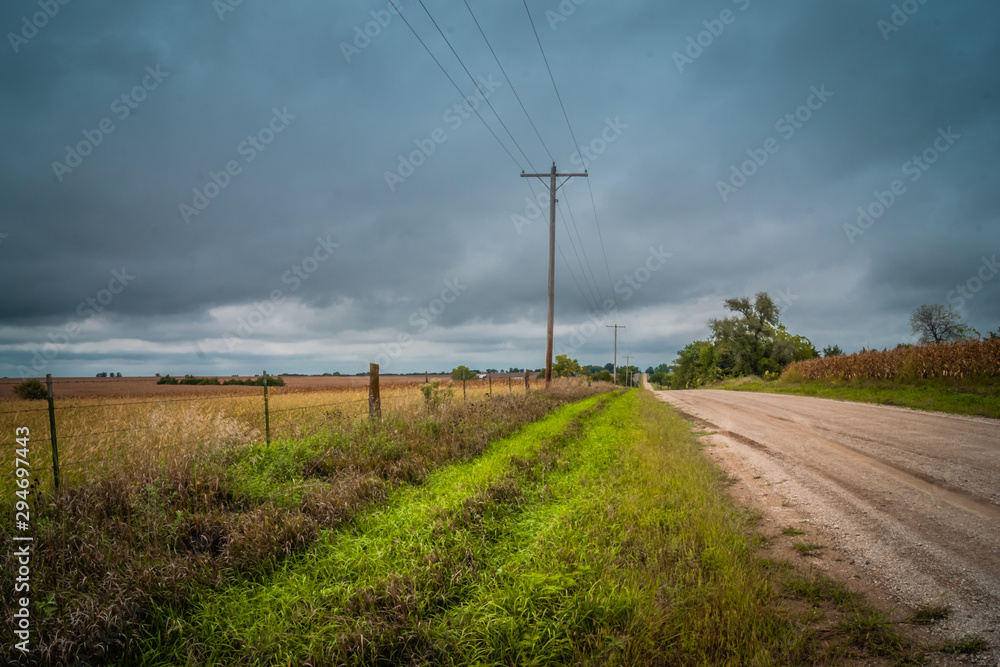 Country road running beside a pasture Country road running beside a pasture
