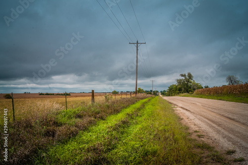 Country road running beside a pasture
