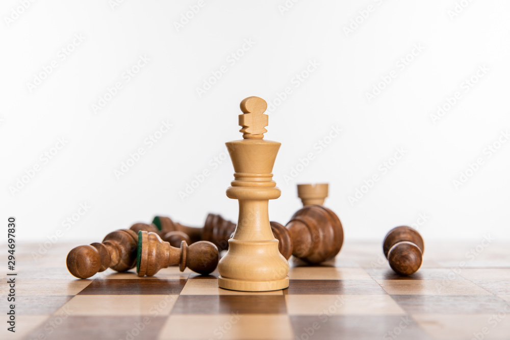 Fototapeta premium black and white chess figures on chessboard isolated on white