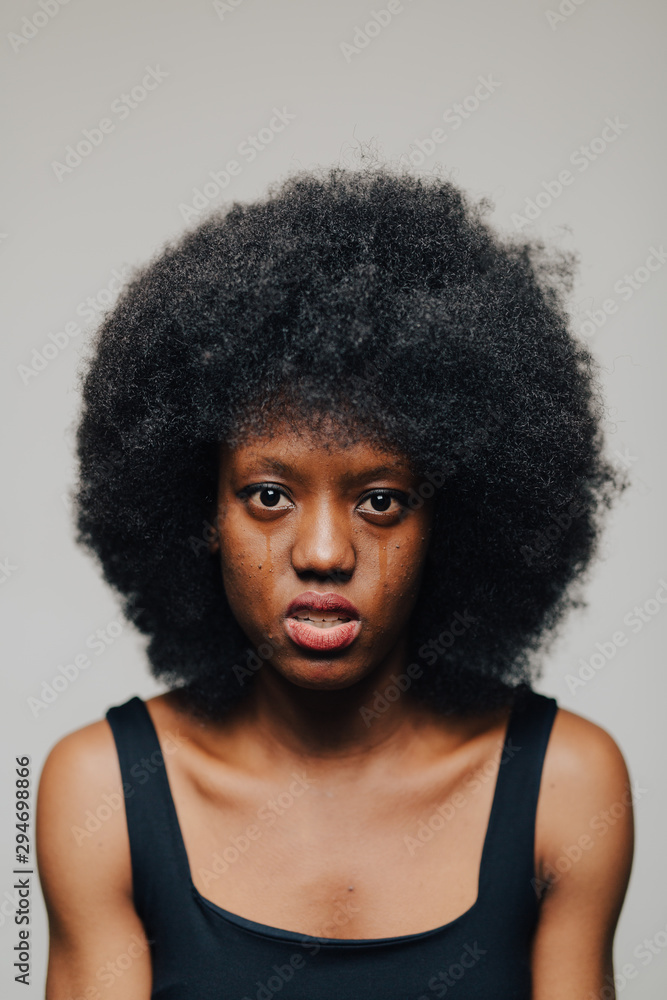 Young afro hairstyle woman. Young afro hairstyle woman.