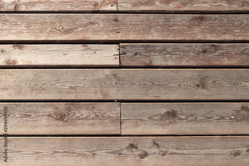 Background from wooden boards. Texture of the old boards. Background, texture of the old wooden floor.Old wooden boards. Background from wooden boards. Texture of the old boards. Background, texture of the old wooden floor.Old wooden boards.