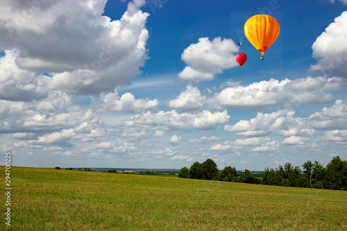 Balloons fly high above the fields.