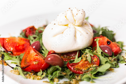 Salad with buratta cheese and tomatoes