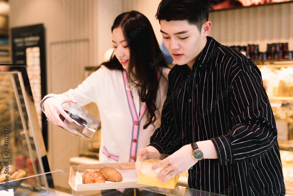 Young couple buying bakery products in store Young couple buying bakery products in store
