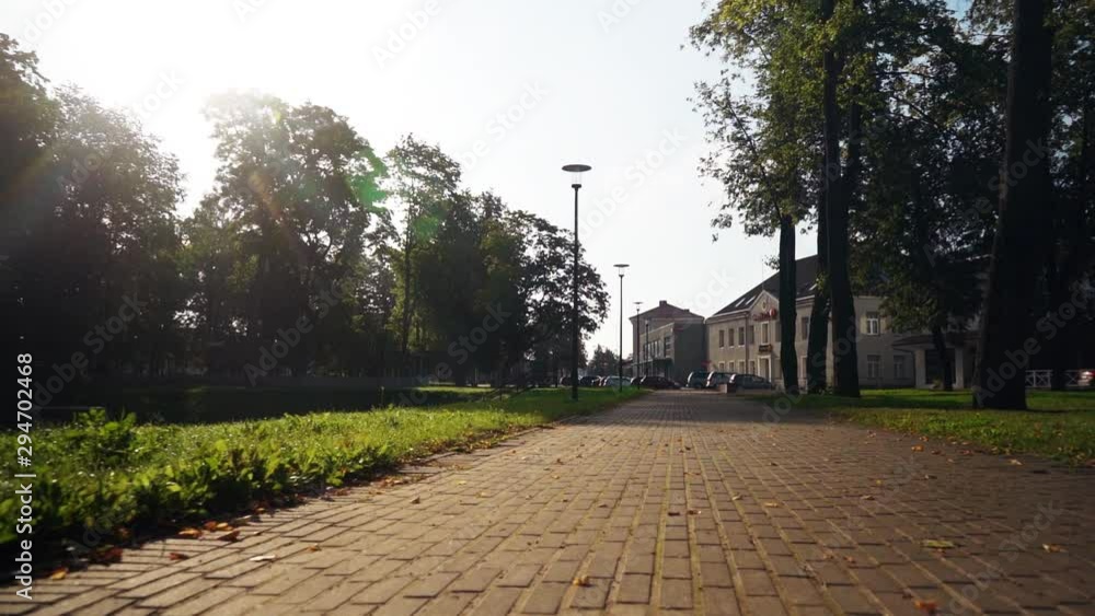 Steadicam shot of the sunrise in small town. Autumn city landscape. Slow motion footage. Steadicam shot of the sunrise in small town. Autumn city landscape. Slow motion footage.