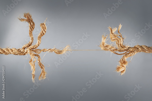 Rope near to break on gray ...