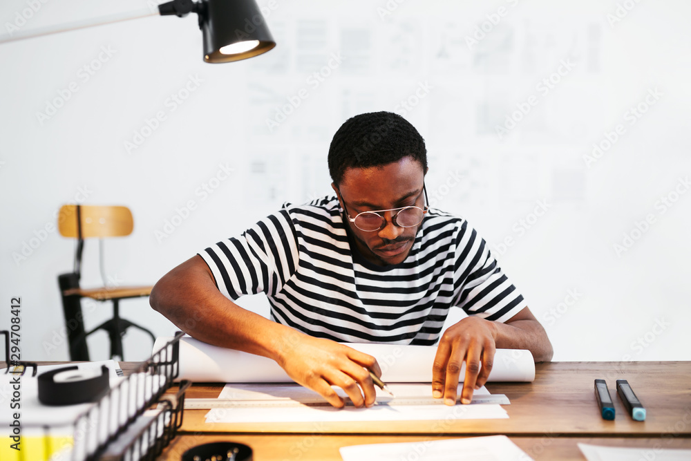 Designer working on the new project. Designer working on the new project.