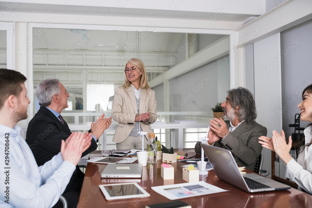 Business people applauding during a meeting Business people applauding during a meeting