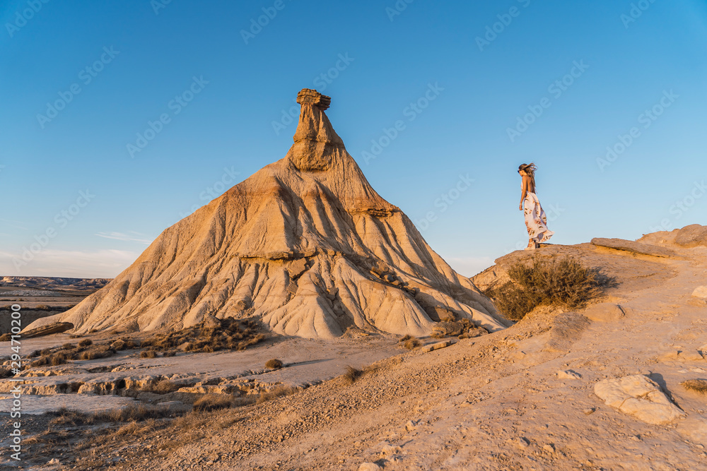 Lifestyle session of a blonde model with white dress in Castildepiedra de las Bardenas, Navarra. Spain