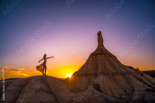 Lifestyle session of a model with a dress at sunset in Las Bardenas  Navarra. Spain