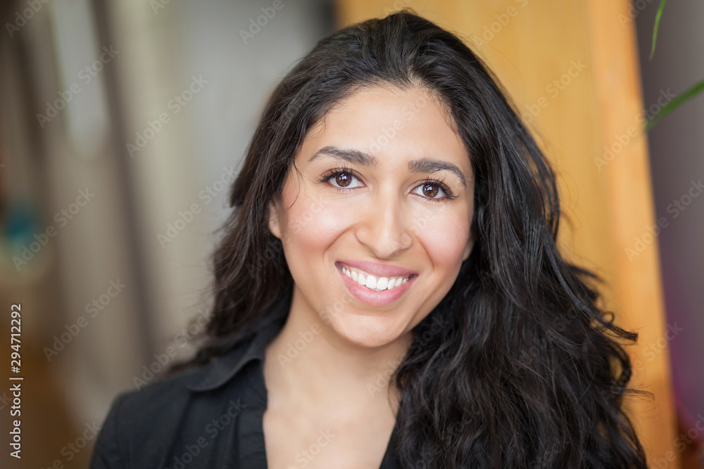 Latin woman smiling at the office. She is really happy. Latin woman smiling at the office. She is really happy.
